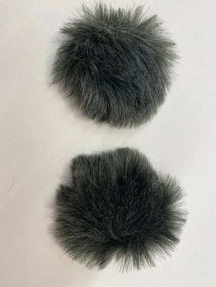 Wind muffs with rubber band, held on the ear lobe