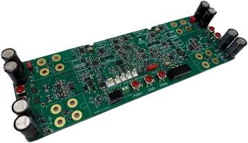 The Baffless amplifier board that drives the Single Speaker Stereo: one PCB carrying the Sabre DAC and both amplifier channels, with the output transistors and their gold-plated mounting rings along both long edges and the power supply capacitors at each end